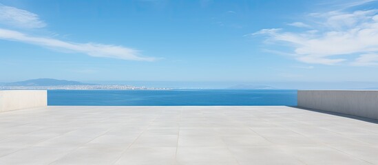 empty concrete floor and blue sea in blue sky. Creative banner. Copyspace image
