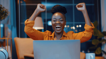 A delighted woman cheers in front of her laptop screen, announcing Nigeria business celebration accomplishments on the night news, her happiness palpable as she revels in her succe