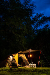 Set up a tent in the dusk at campground