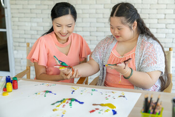 Mother and child are doing art activities together at home