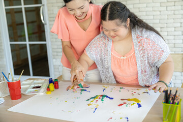 Mother and child are doing art activities together at home