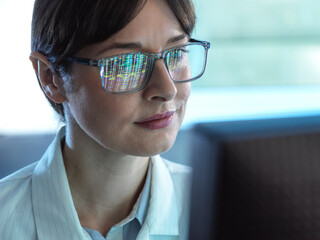 Genomics, Scientist viewing human DNA profiles on screen during testing in the lab