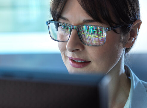 Genomics, Scientist viewing human DNA profiles on screen during testing in the lab