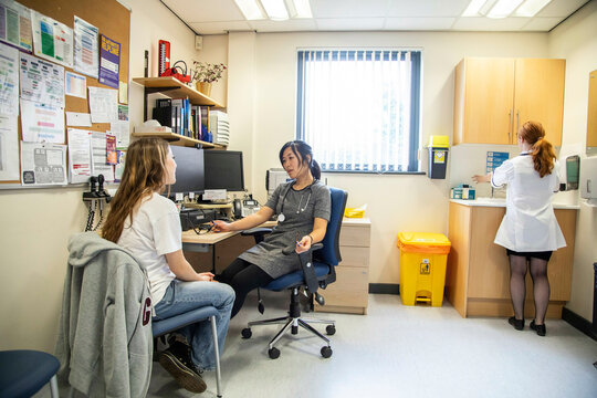 Doctor consulting a patient in a medical office.