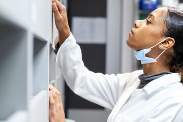 Medical professional in a lab setting, working in a medical practice, UK