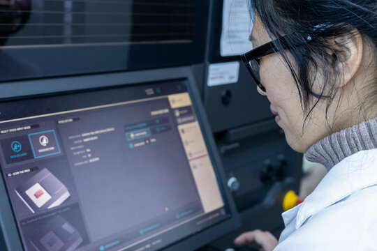 Woman using a touchscreen panel in a medical practice