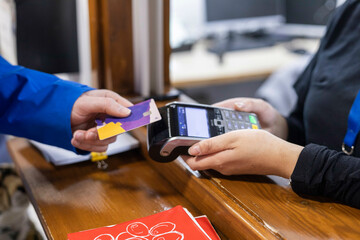 Customer making a payment with a card in a medical practice