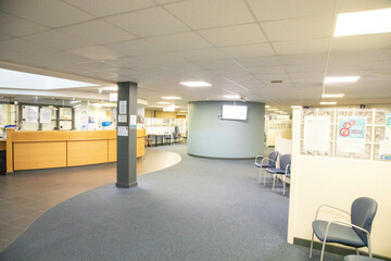 Empty Spacious waiting area with chairs and bulletin boards in a medical practise