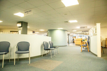 Empty Spacious waiting area with chairs and bulletin boards in a medical practise