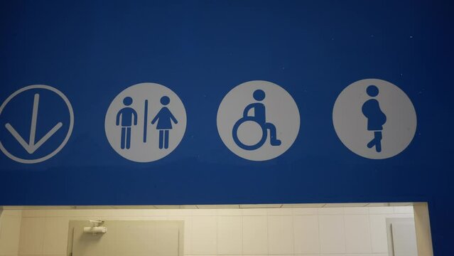 WC sign. Toilet or WC. Signboard handicap toilet sign, toilet for people with disabilities, pregnant women. Female and male symbols on plates for public toilets, water closets. Pointer wc at the airpo