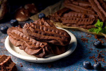 Chocolate shortbread cookies. Dark background