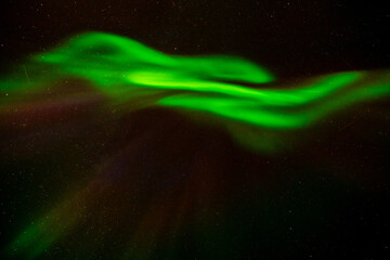 Polar lights, Aurora borealis in green over mountains, Norway
