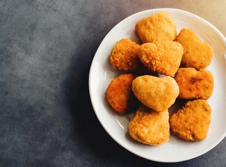 Nuggets isolated on dark rustic background closeup