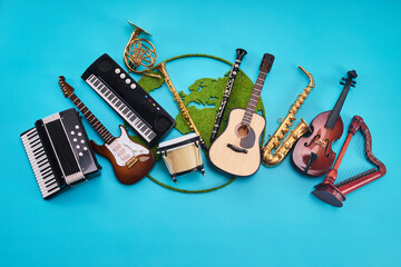 World Music Day. Assortment of Musical Instruments with world map on Blue background