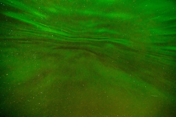 Polar lights, Aurora borealis in green over mountains, Norway