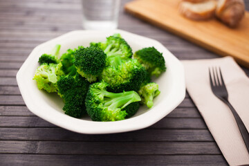 Diet food. steamed broccoli on plate