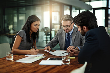 Businesspeople, deal and meeting with documents in boardroom, office and sign for corporate b2b...