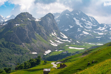 Picturesque panoramic view of the snowy Alps mountains and meadows while hiking Tour du Mont Blanc. Popular tourist attraction. Alps, Chamonix-Mont-Blanc region, France, Europe. Hiking concept