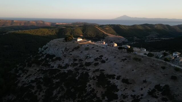 Kastro on Thassos at sunset with the mountains and sea behind as rotates around the village by drone