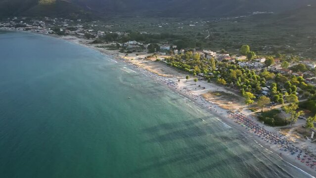 Golden Beach, thassos, greece, drone flight shing town and beach down to skala potamia