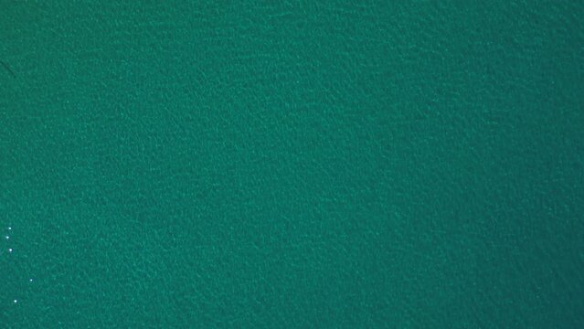 overhead view of the aegean sea clear waters with power boat stationary in the middle