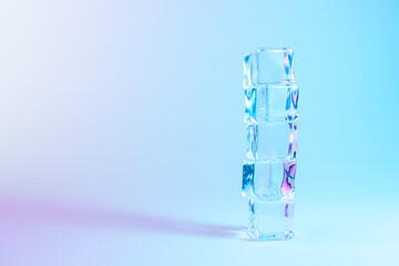 Creative layout of ice cubes in vibrant bold gradient holographic colors. Concept art. Minimal surrealism.