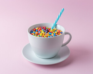 Celebration background with white cup and colorful confetti. Minimal party concept.