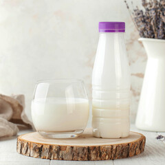 Drinking yogurt in a stylish glass and a bottle