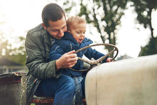 Happy, father teaching son to drive tractor for learning, growth and bonding outdoor in nature. Excited, dad and kid on farming vehicle for agriculture knowledge and information with fun lesson
