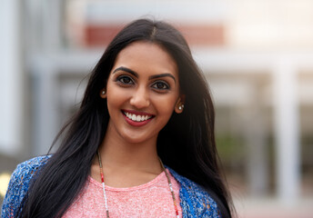 College student, portrait and happy at university for scholarship and learning at campus for summer. Indian woman, smile and outdoor for class schedule or update, back to school and gen z at academy