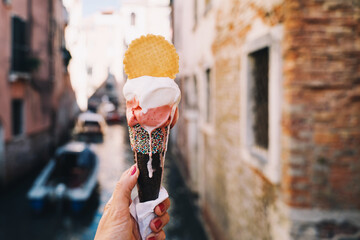 Delicious gelato or ice cream in waffle cone in Venice Italy.
