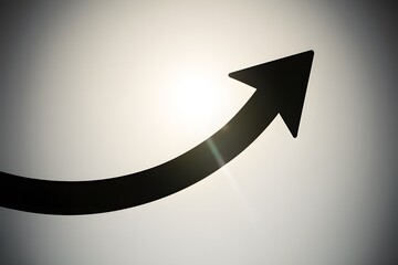Black arrow pointing up and right against bright background shows smooth upward transition