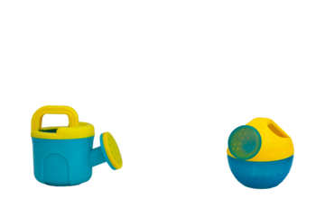 Children's toys for playing in the sand. Two watering cans for sandpit without background. For text
