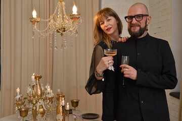 A large family with children posing in pajamas in New Year's locations.