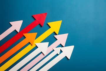 Fototapeta premium Colorful arrows on blue background symbolize growth and movement, creating a dynamic visual