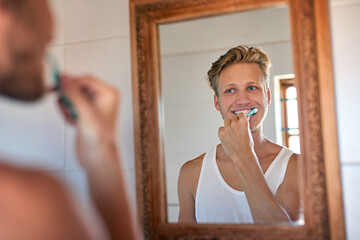 Dental care, mirror and man brushing teeth in home for health, wellness and morning routine....