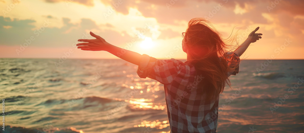 Wall mural happy woman enjoying with open hands on sea, summer travel concept background