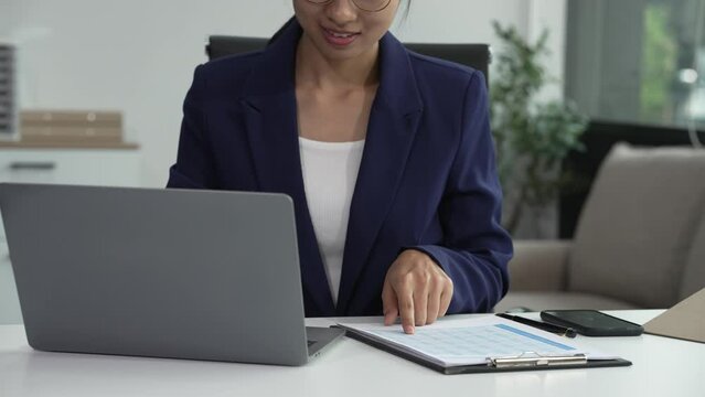 Asian businesswoman specializing in stock market and financial services, including roles as a loan officer, investment banker, legal advisor, discusses loan applications and investment strategies