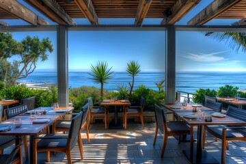 Obraz premium Scenic Outdoor Dining with Breathtaking Ocean View in Tropical Setting