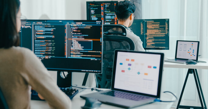 Closeup Adult Asia male, female freelance typing write prompt AI bot IT app smart program nomad, video game, terminal with coding language, user interface, designer, big data center desktop computer.