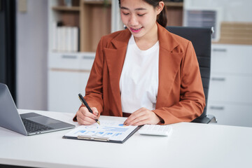 Asian businesswoman specializing in stock market and financial services, including roles as a loan...