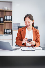 Asian businesswoman specializing in stock market and financial services, including roles as a loan...