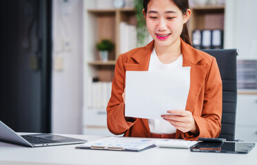 Asian businesswoman specializing in stock market and financial services, including roles as a loan...