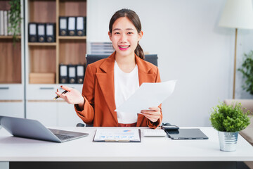 Asian businesswoman specializing in stock market and financial services, including roles as a loan...