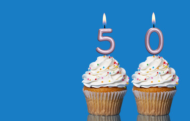 Birthday Cupcakes With Candles Lit Forming The Number 50