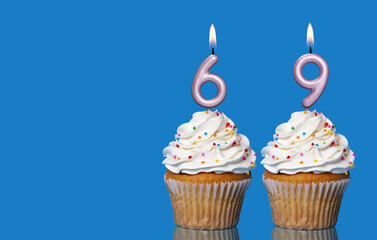 Birthday Cupcakes With Candles Lit Forming The Number 69