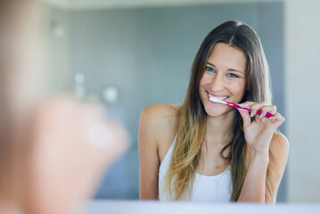 Mirror, smile and woman with toothbrush in bathroom for oral hygiene, cleaning and morning routine....