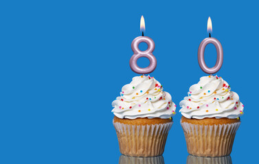 Birthday Cupcakes With Candles Lit Forming The Number 80