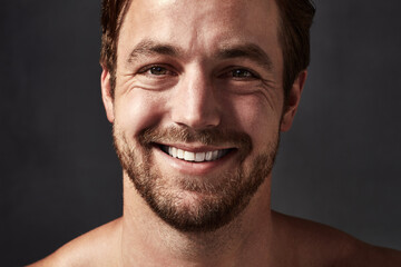 Man, portrait and shine of skincare in studio, confidence and beauty on black background, Male...