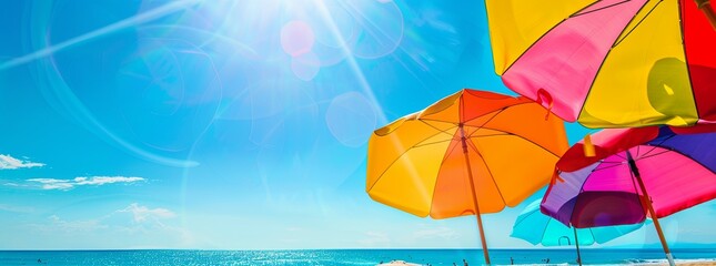 A vibrant, summer beach background with bright sun, blue sky, and colorful umbrellas.